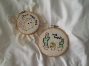 two embroidery hoops displayed on a white background